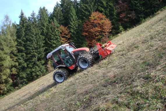 Test vehicle drives on a steep meadow (Driving dynamics of vehicles)