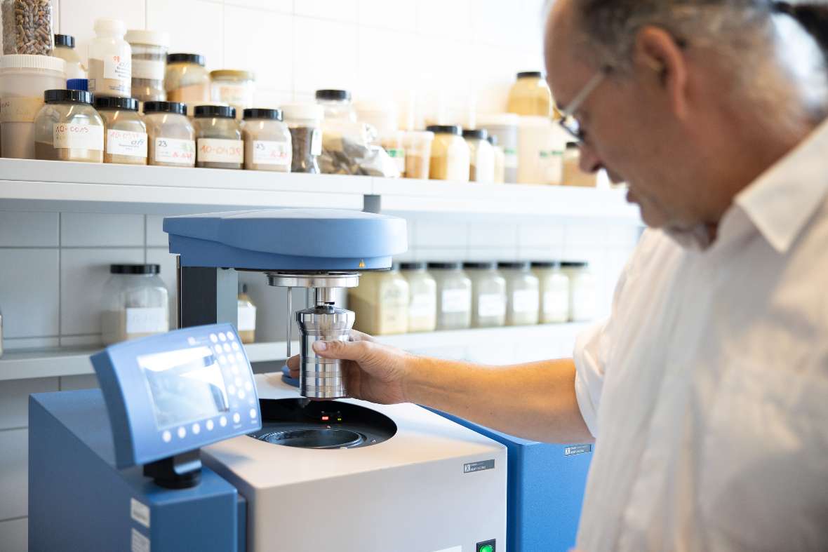 Man stands in front of a laboratory device